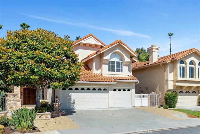 29211 Alfieri St, Laguna Niguel, CA 92677 - mediterranean / spanish home with stucco siding, driveway, a tiled roof, and an attached garage