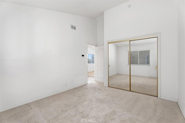 29211 Alfieri St, Laguna Niguel, CA 92677 - unfurnished bedroom featuring carpet floors, a closet, baseboards, and high vaulted ceiling