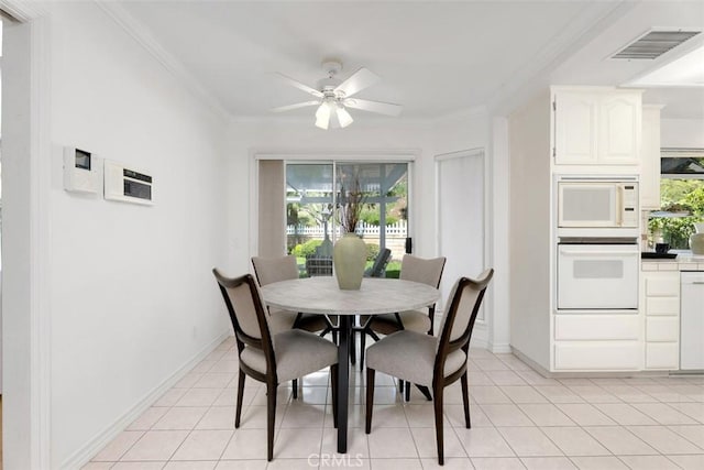 29211 Alfieri St, Laguna Niguel, CA 92677 - dining area with crown molding, a ceiling fan, baseboards, and light tile patterned floors