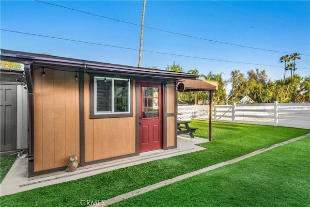 view of outbuilding with an outbuilding and fence private yard