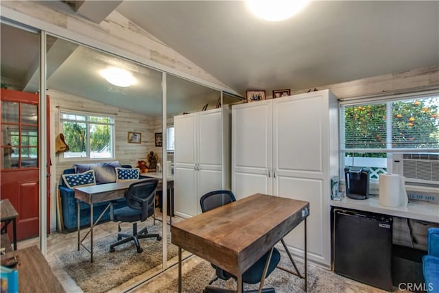 home office with cooling unit, vaulted ceiling, and wood walls