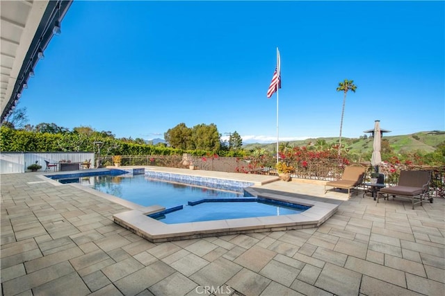 view of swimming pool featuring a fenced in pool, a fenced backyard, and a patio area