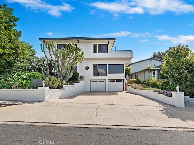 2080 Saint Louis Ave, Signal Hill, CA 90755 - modern home featuring a garage, stucco siding, fence, and concrete driveway