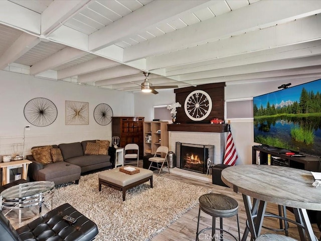 2080 Saint Louis Ave, Signal Hill, CA 90755 - living area with wood finished floors, ceiling fan, a brick fireplace, and beam ceiling