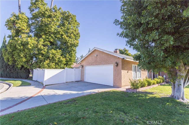 18715 Plummer St, Northridge, CA 91324 - view of side of home with driveway, an attached garage, stucco siding, and a chimney