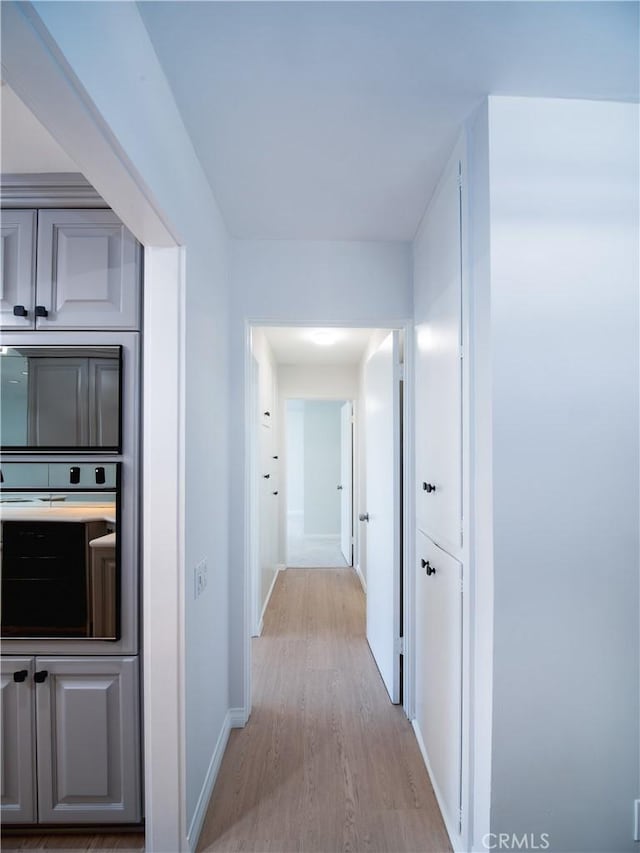 32653 Seagate Dr Unit 205, Rancho Palos Verdes, CA 90275 - corridor with baseboards and light wood-style floors
