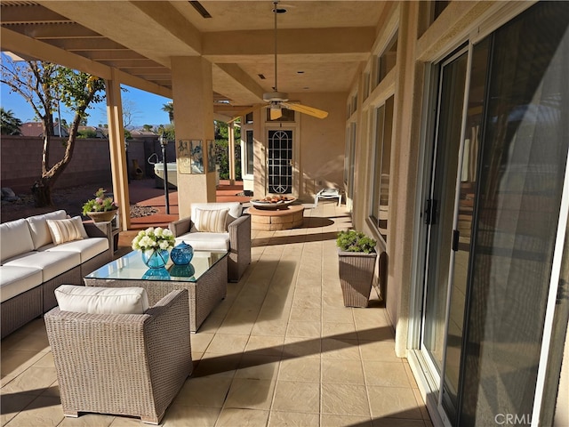 37467 Golden Pebble Ave, Palm Desert, CA 92211 - view of patio / terrace featuring an outdoor living space with a fire pit, fence, and ceiling fan