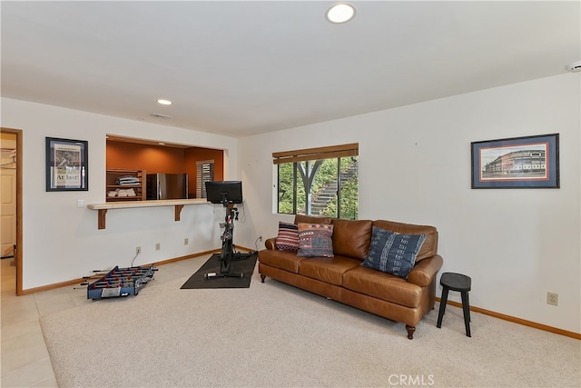 living area with recessed lighting, visible vents, baseboards, and tile patterned flooring