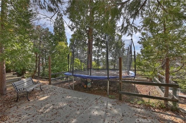 view of yard featuring a trampoline