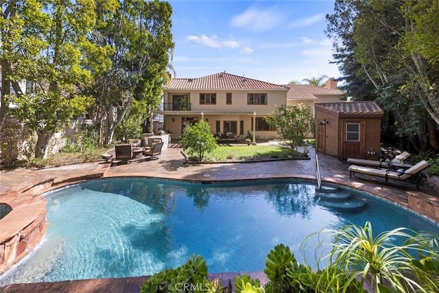 24925 Vista Verenda, Woodland Hills, CA 91367 - outdoor pool with an outbuilding, a patio, an outdoor living space, and a storage unit