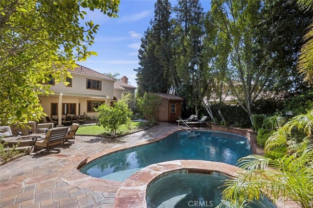 24925 Vista Verenda, Woodland Hills, CA 91367 - view of pool with an outdoor living space, a patio, a shed, an outdoor structure, and a pool with connected hot tub