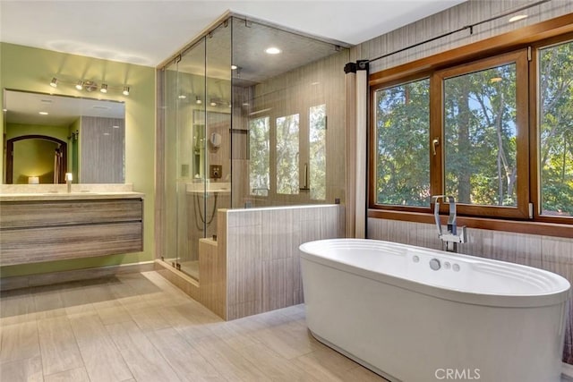 24925 Vista Verenda, Woodland Hills, CA 91367 - full bathroom with a shower stall, vanity, and a freestanding bath