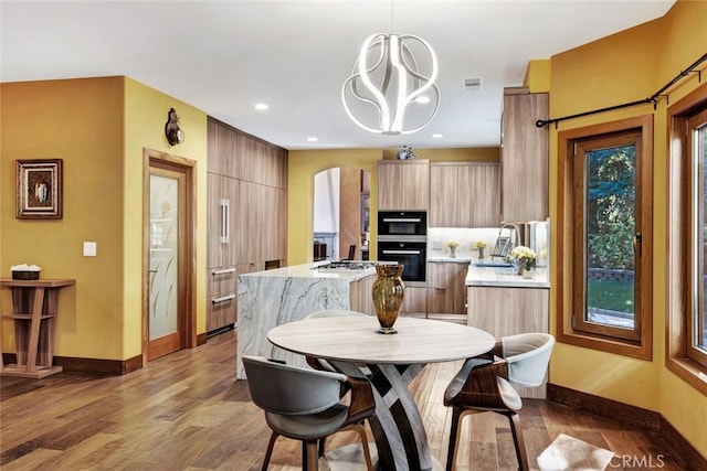 24925 Vista Verenda, Woodland Hills, CA 91367 - dining room featuring arched walkways, baseboards, wood finished floors, and recessed lighting