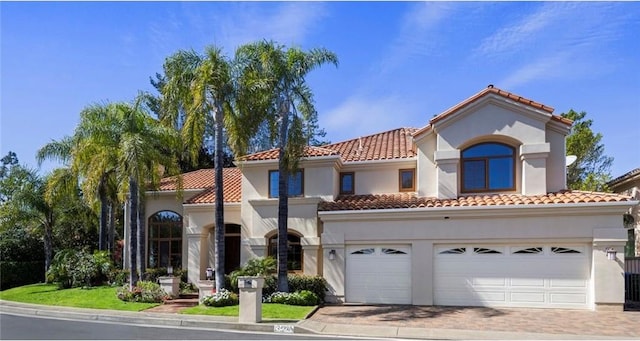 24925 Vista Verenda, Woodland Hills, CA 91367 - mediterranean / spanish-style house with a tiled roof, driveway, and stucco siding