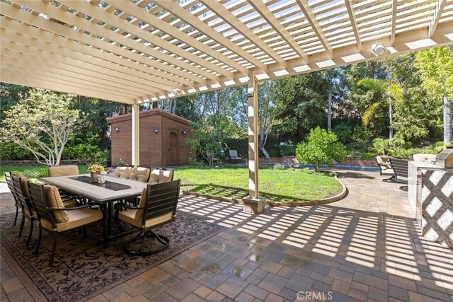 24925 Vista Verenda, Woodland Hills, CA 91367 - view of patio featuring outdoor dining area, a pergola, an outbuilding, a storage shed, and view of wooded area