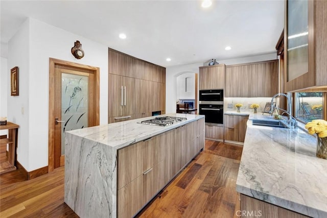 24925 Vista Verenda, Woodland Hills, CA 91367 - kitchen with modern cabinets, stainless steel gas cooktop, and recessed lighting