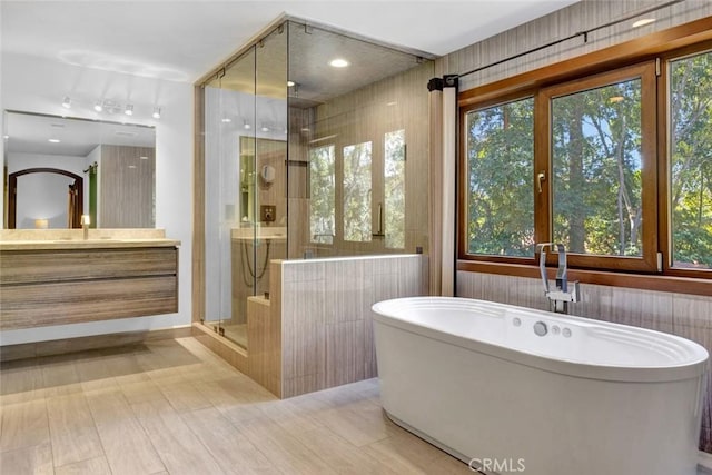 24925 Vista Verenda, Woodland Hills, CA 91367 - bathroom featuring vanity, a shower stall, and a freestanding tub