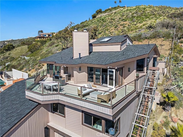 15 Vista De Catalina N, Laguna Beach, CA 92651 - back of property featuring a shingled roof, a chimney, and an outdoor hangout area