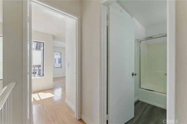 8028 Harrison St, Paramount, CA 90723 - hallway featuring baseboards and wood finished floors