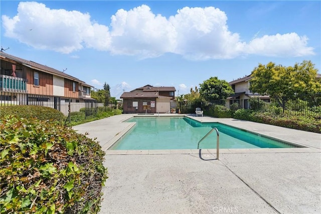 8028 Harrison St, Paramount, CA 90723 - community pool with a patio area and fence