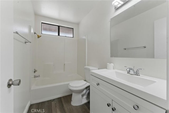 8028 Harrison St, Paramount, CA 90723 - full bath featuring wood finished floors, toilet, shower / bath combination, and vanity