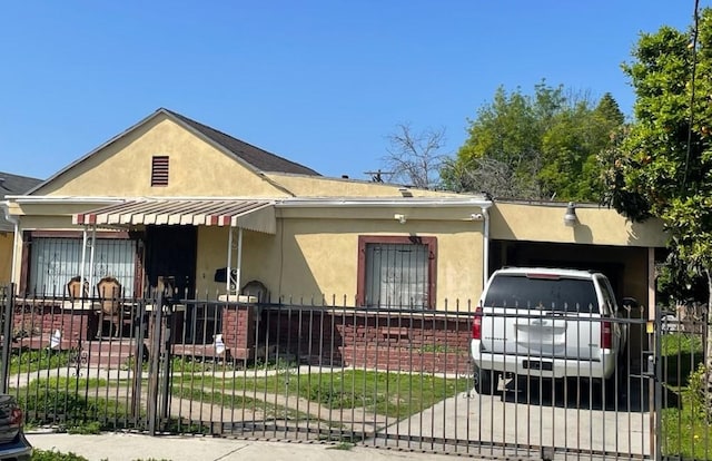 view of front of home featuring fence private yard and stucco siding