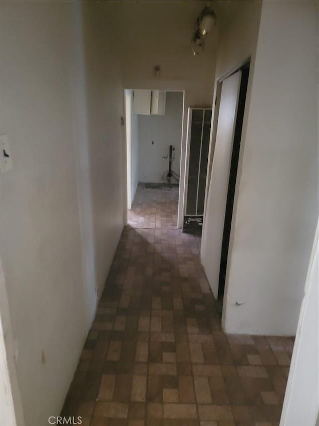 hall with brick patterned floor