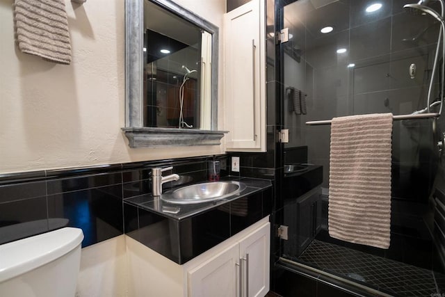 27509 Mountain Meadow Rd, Escondido, CA 92026 - bathroom with toilet, tile walls, a stall shower, vanity, and a textured wall