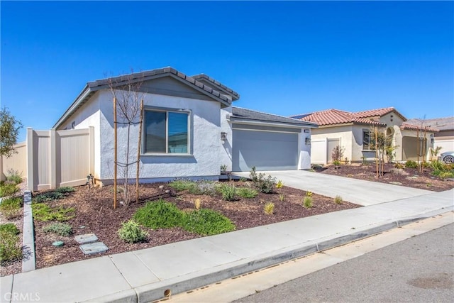 1567 Park Haven Dr, Beaumont, CA 92223 - view of front of property featuring stucco siding, a garage, driveway, and a tiled roof