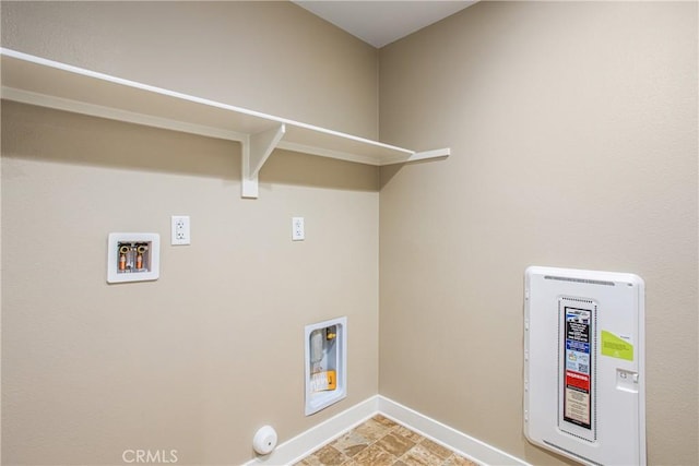 laundry area featuring baseboards, hookup for a washing machine, laundry area, and gas dryer hookup