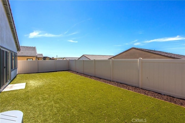 view of yard featuring a fenced backyard