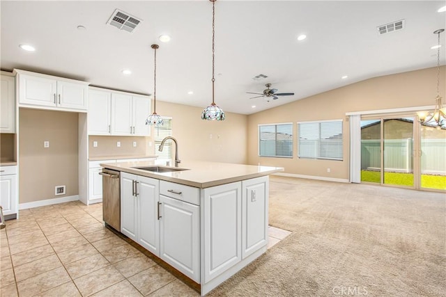 kitchen featuring ceiling fan, dishwasher, a sink, and visible vents