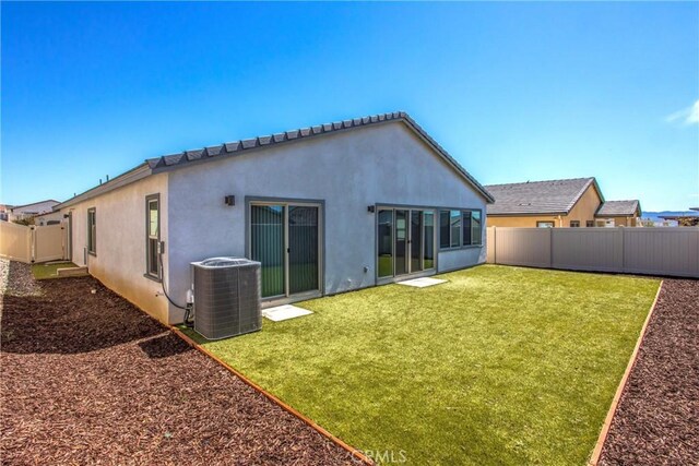 1567 Park Haven Dr, Beaumont, CA 92223 - rear view of house with stucco siding and central AC