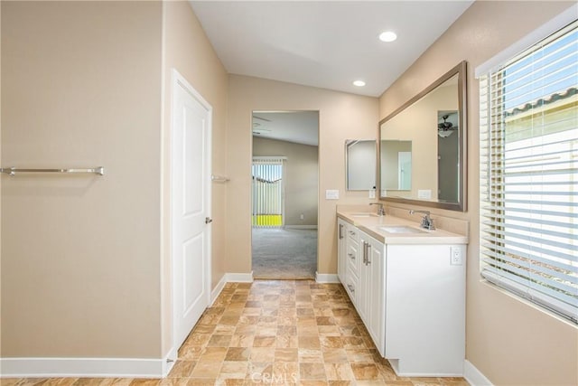 1567 Park Haven Dr, Beaumont, CA 92223 - bathroom with double vanity, stone finish flooring, and recessed lighting