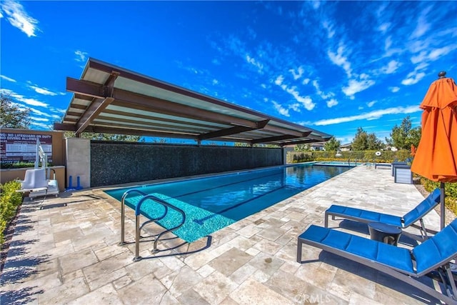 community pool with a patio area