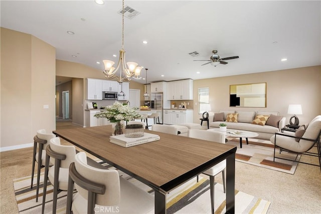 dining room with recessed lighting, visible vents, light colored carpet, and ceiling fan with notable chandelier
