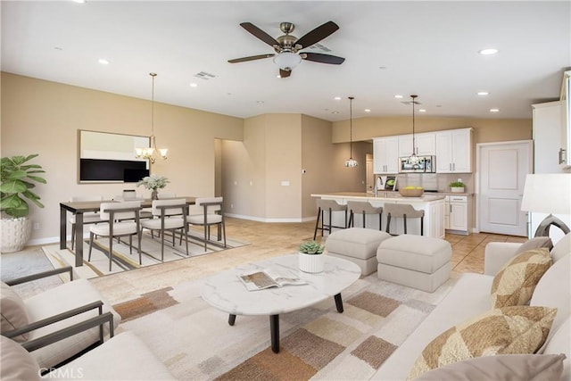 1567 Park Haven Dr, Beaumont, CA 92223 - living room featuring baseboards, a chandelier, recessed lighting, ceiling fan, and light tile patterned floors