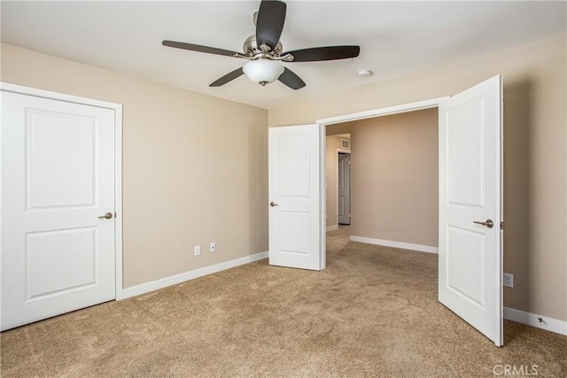 1567 Park Haven Dr, Beaumont, CA 92223 - unfurnished bedroom with light carpet, baseboards, and ceiling fan