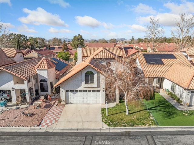 19246 Pine Way, Apple Valley, CA 92308 - mediterranean / spanish house with a residential view, solar panels, driveway, and stucco siding