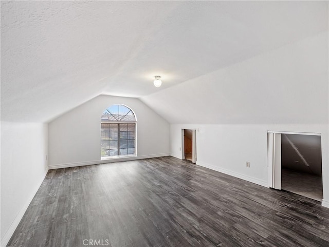 19246 Pine Way, Apple Valley, CA 92308 - additional living space with dark wood finished floors, lofted ceiling, and baseboards