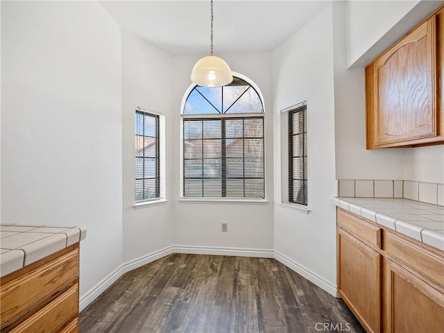 19246 Pine Way, Apple Valley, CA 92308 - unfurnished dining area featuring dark wood finished floors and baseboards