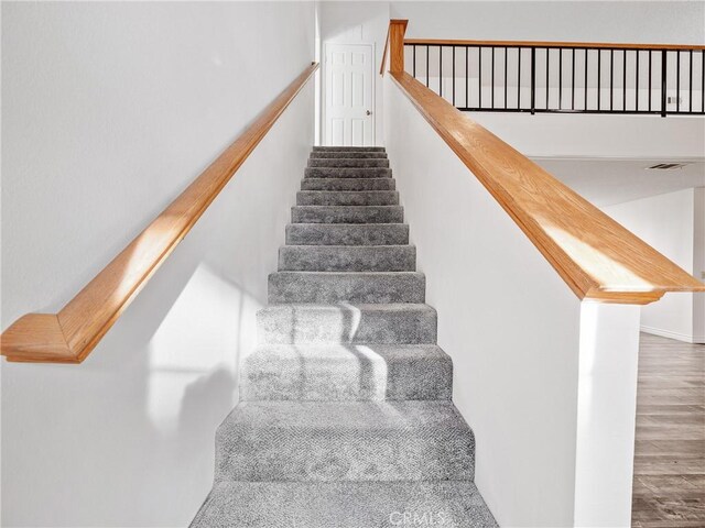 19246 Pine Way, Apple Valley, CA 92308 - stairs featuring wood finished floors