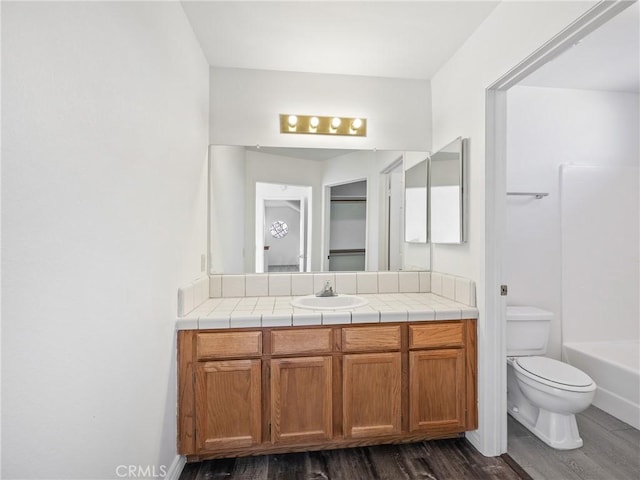 19246 Pine Way, Apple Valley, CA 92308 - bathroom with wood finished floors, vanity, toilet, and shower / bath combination