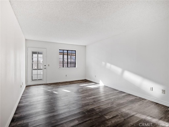 19246 Pine Way, Apple Valley, CA 92308 - unfurnished room featuring a textured ceiling, dark wood-type flooring, and baseboards