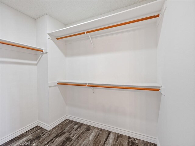 19246 Pine Way, Apple Valley, CA 92308 - spacious closet featuring dark wood finished floors