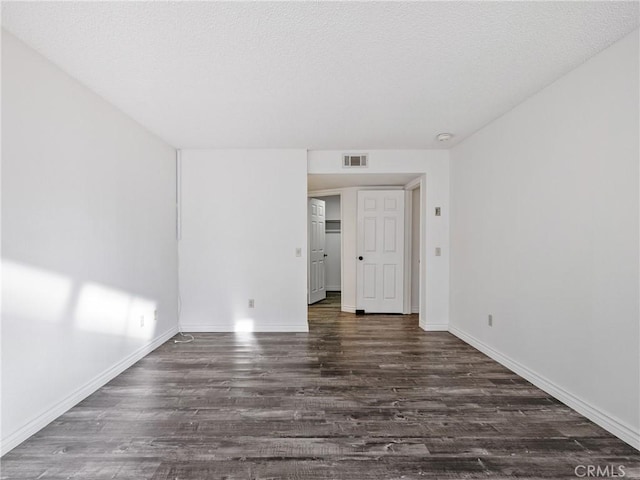 19246 Pine Way, Apple Valley, CA 92308 - unfurnished room with wood finished floors, baseboards, and a textured ceiling