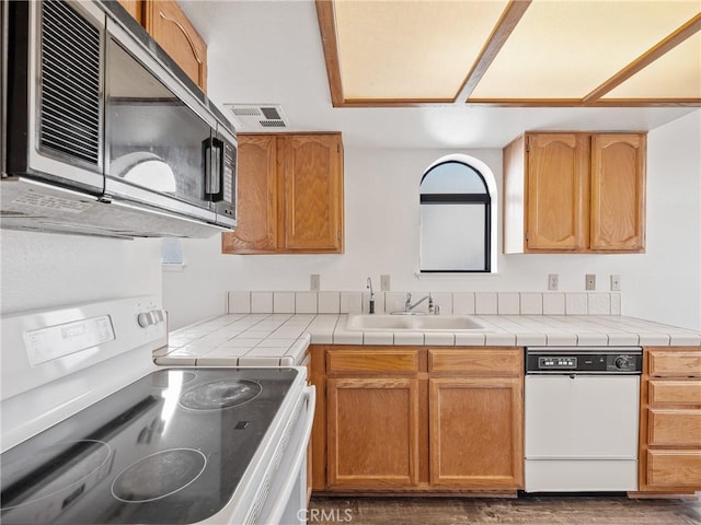 19246 Pine Way, Apple Valley, CA 92308 - kitchen with white appliances, a sink, plenty of natural light, and wood finished floors