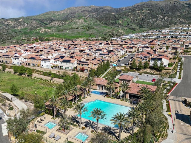 birds eye view of property featuring a mountain view and a residential view
