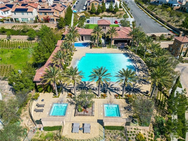 birds eye view of property with a residential view