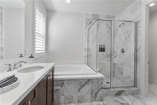 bathroom with recessed lighting, marble finish floor, vanity, a marble finish shower, and a bath